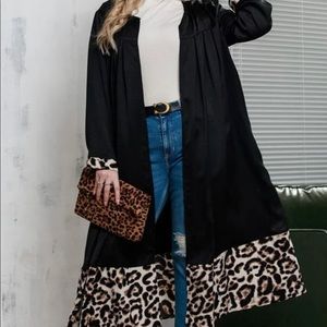 Black duster with leopard print edging.